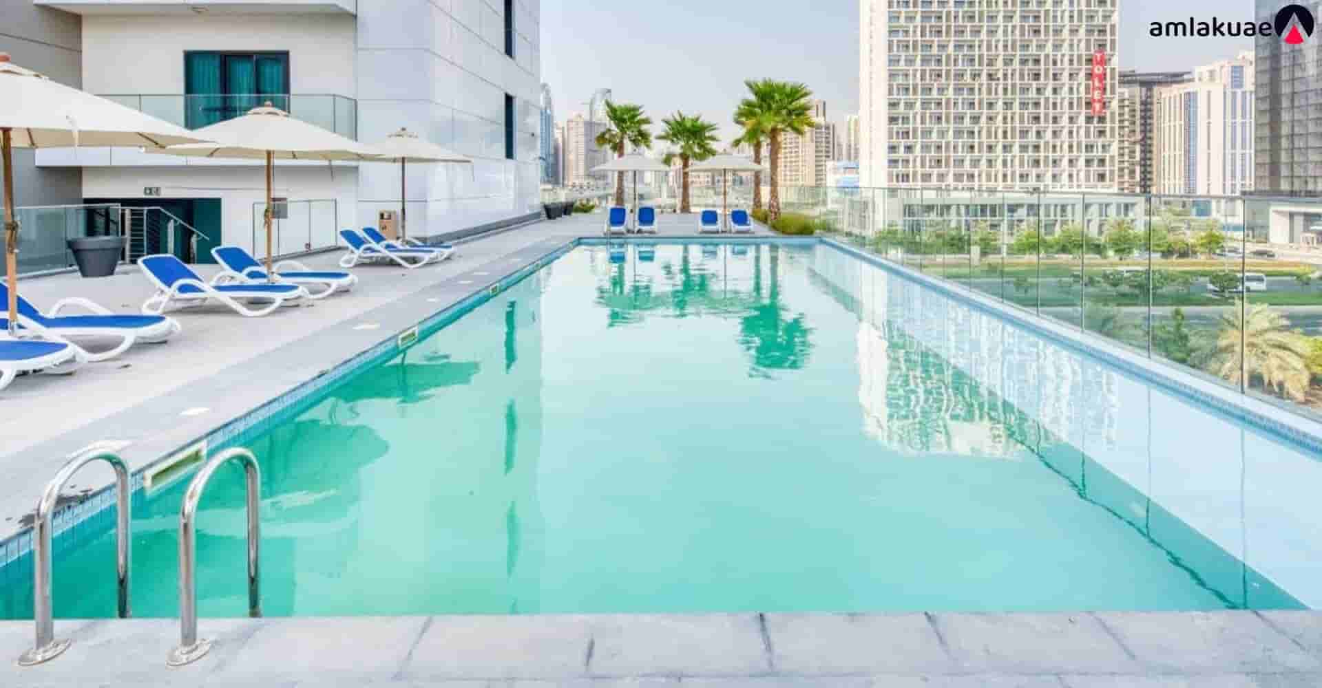 Outdoor swimming pool of Sol Bay apartments - Amlakuae Group