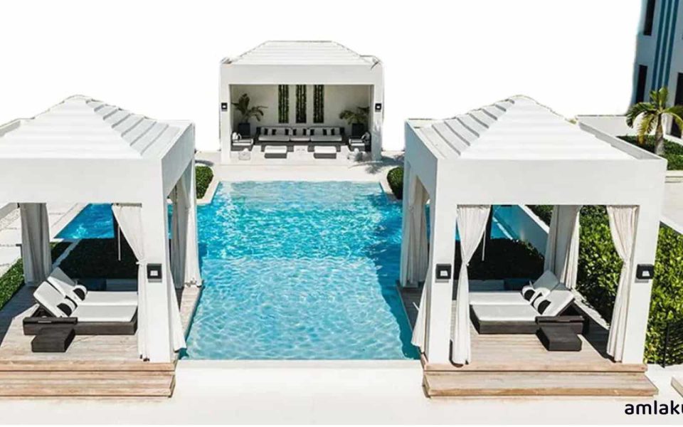 Swimming Pool and Poolside Amenities at AG 9INE Apartments - Amlakuae