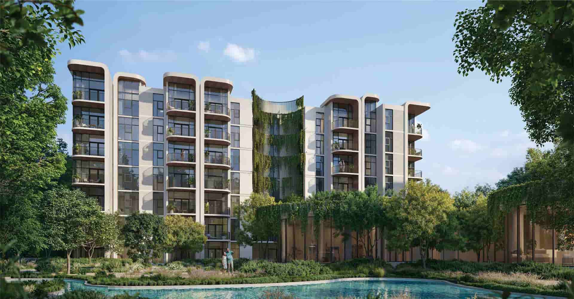 The building is surrounded by lush green spaces for a peaceful lifestyle - Amlakuae Group